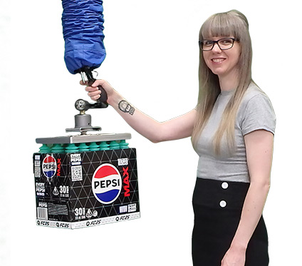 Operator lifting a carton from a stacked position using vacuum suction